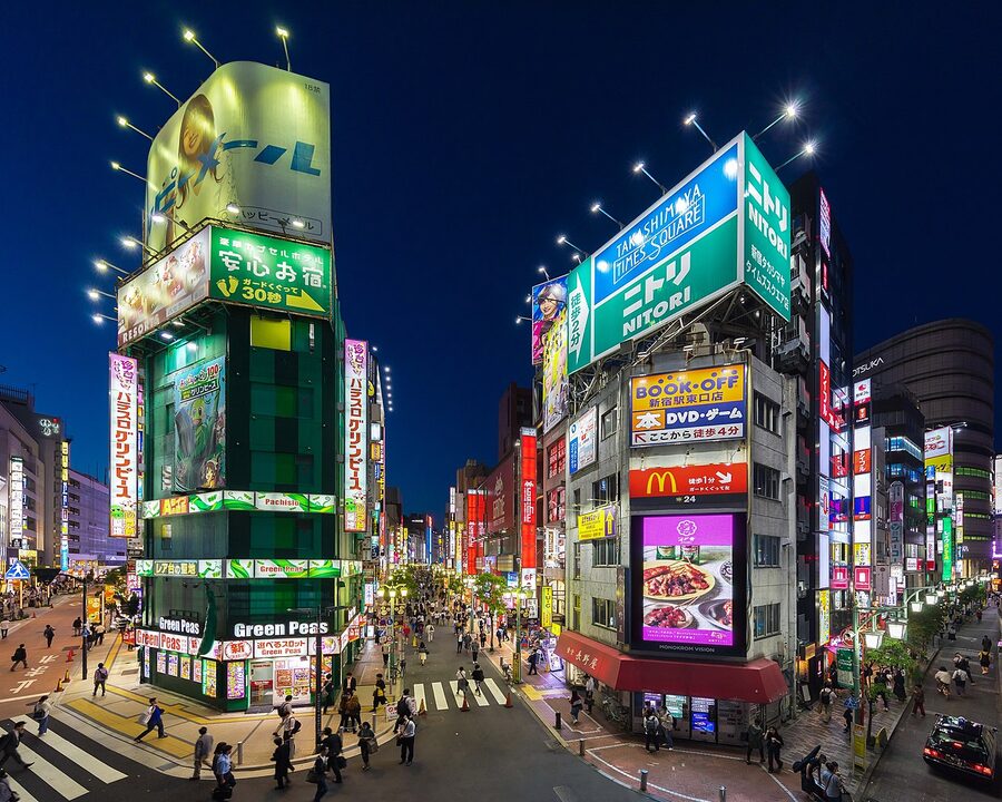 Colourful neon facades of buildings at night in Shinjuku Tokyo