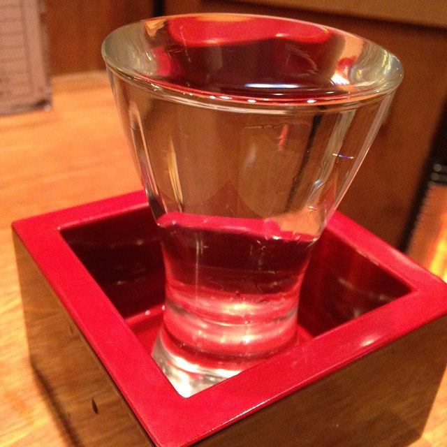 A green bottle of Ugo no Tsuki Junmai Ginjo Namazake from Aihara Brewery, Hiroshima