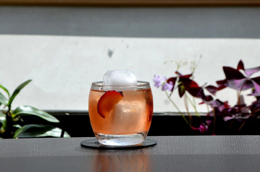 An umeshu-based negroni cocktail in a tumbler