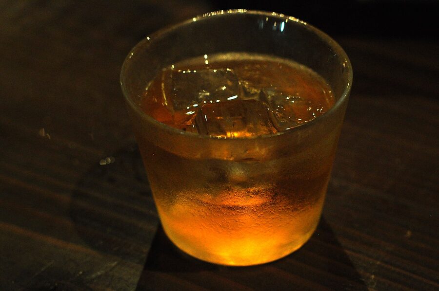 A glass of umeshu, classic amber colour