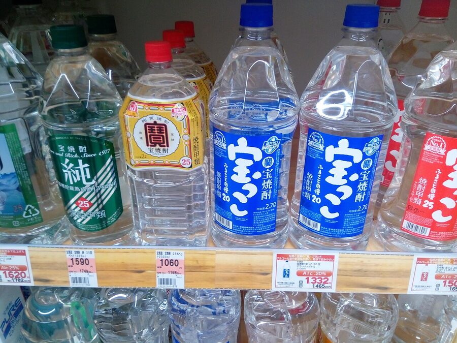 A row of large plastic bottles of shochu in an Aizu-Wakamatsu supermarket