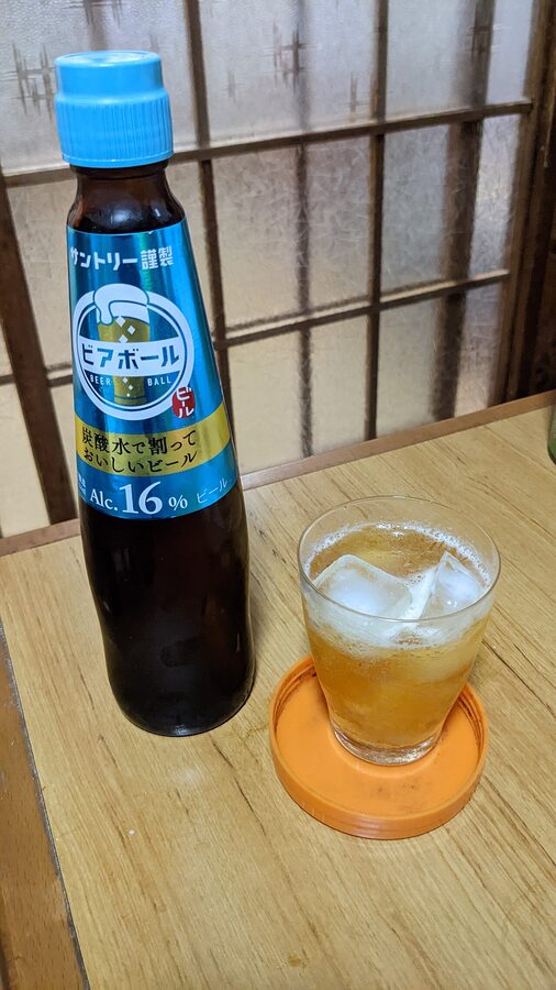 A glass of Suntory Premium Malt's beer on a counter, the default first round at any yakitori shop