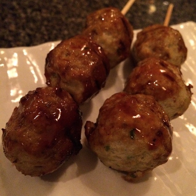 A plate of tsukune chicken meatball skewers, the cut most often paired with raw yolk and tare